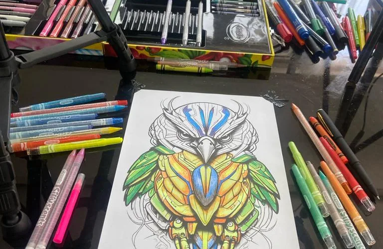 Image of Akinwale Arokodare coloring an AI generated Owl Image